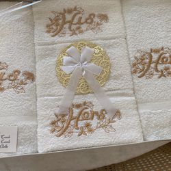 A Set Of White Towels His and Hers Embroidered With Gold Thread 