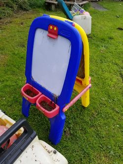 Children's art easel excellent condition needs cleaning chalkboard on one side painting on the other