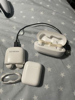 Three Earbud Pods With Broken Earbuds And One Charging Cable