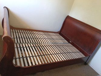 a wooden sleigh bed frame