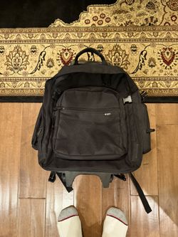 Backpack with wheel and pull handle