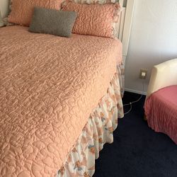 White bed full size with mattress and box spring with a matching white storage cabinet