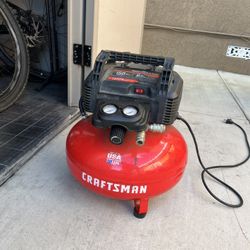 Air compressor and retractable hose reel
