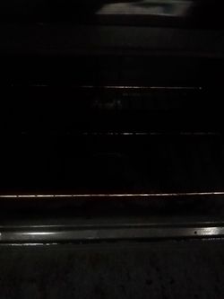 Electric Stove and Black Refrigerator