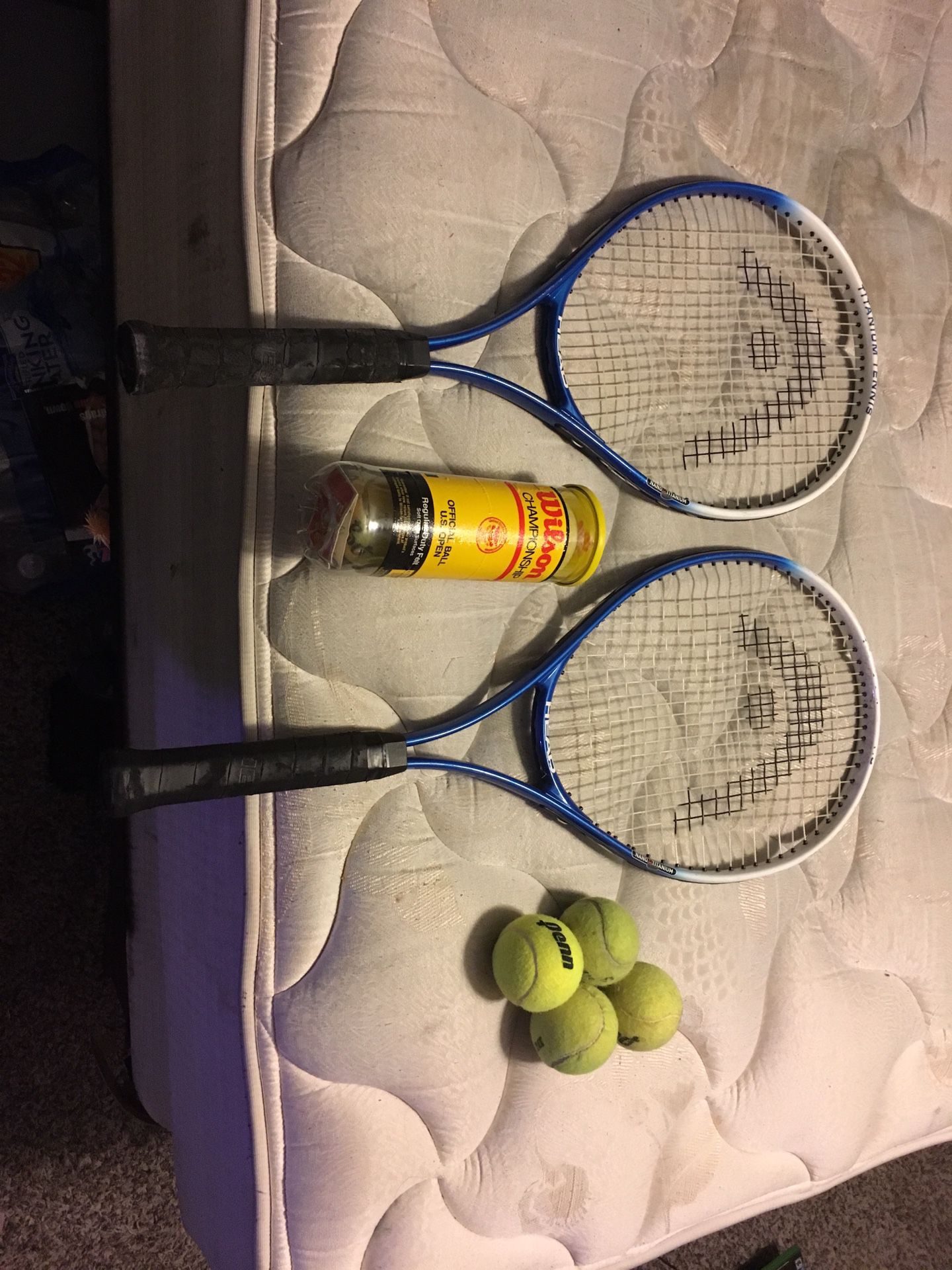 Lightly used tennis rackets with balls