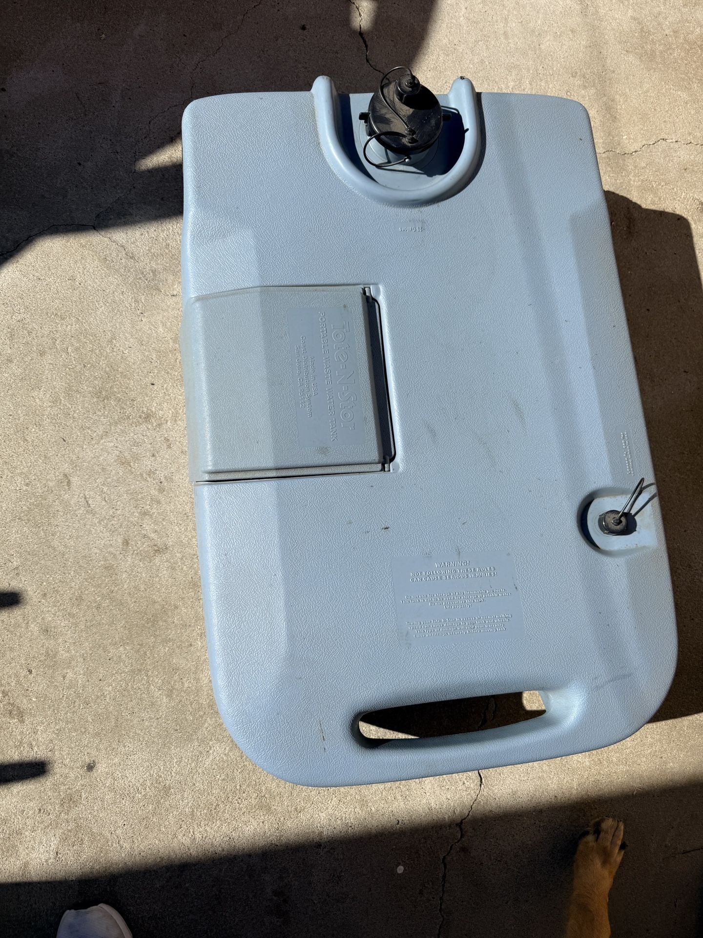 Tote-N-Stor portable RV waste holding tank.