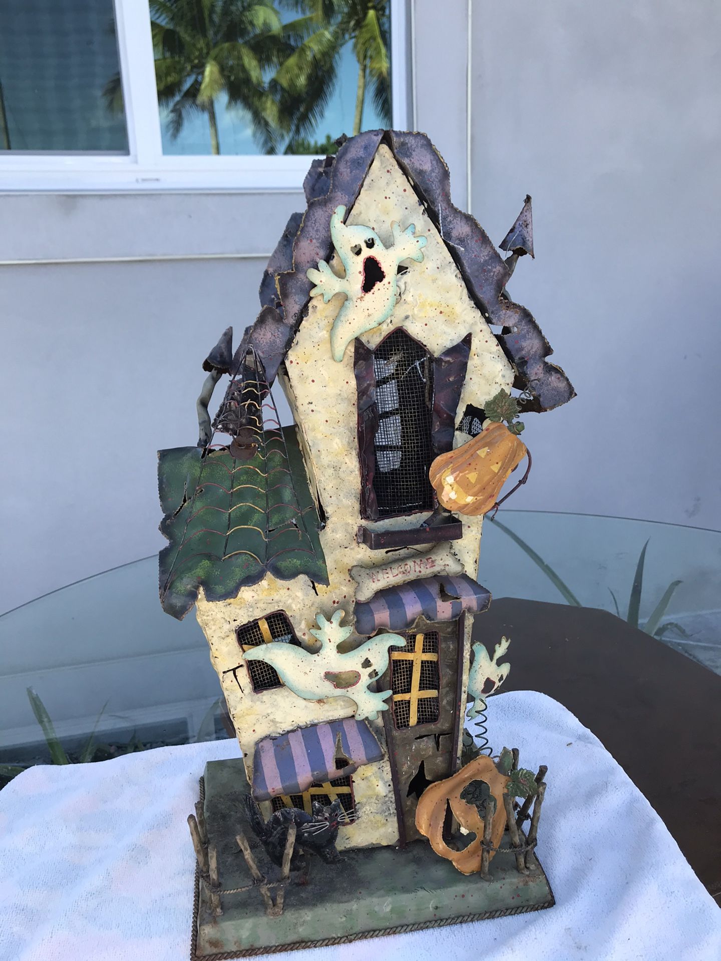 Old metal Haunted house candle holder