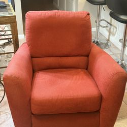 Upholstered chair with built in ottoman 