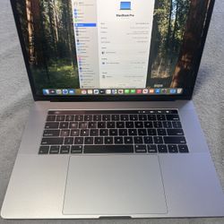 Apple MacBook Pro / 15 inch Touch Bar Retina Display / Core i7 / 16GB RAM/512GB SSD / AMD Radeon GPU