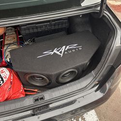 Three Skar SVX-8” 900 watts 4 ohm SPL subs with a Skar 1200 watt RMS amp enclosed in Skar vented box