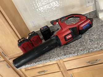 Blower and chainsaw..5 batteries 3 chargers