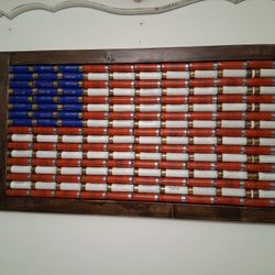  FRAMED SHOTSHELL 12ga. CASING ~ AMERICAN FLAG SIGN ( MADE OF VINTAGE 12ga. SHELL CASINGS ). MEASURES 31" X 17" OVERALL...asking $250.00