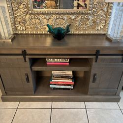 Tamworth TV Stand for TVs up to 75" barnwood doors. Grey wood.
