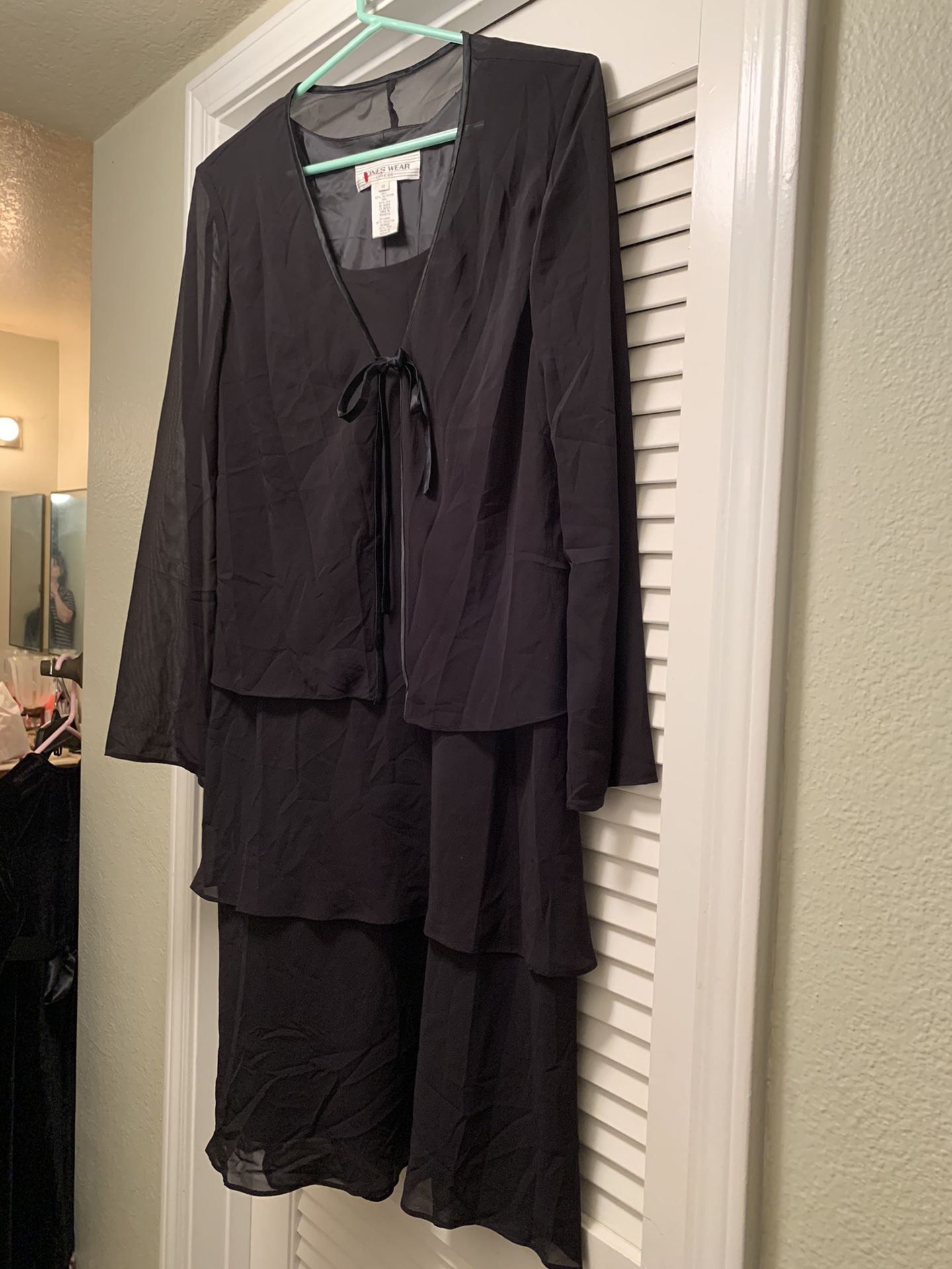 Women’s black tiered dress. Fully lined made by Jones of NY. Size 12.