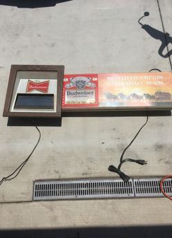 2 light up Budweiser signs
