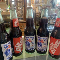 Vintage 1990s DESERT STORM Dr Pepper bottles. 14.00 each.  Johanna at Antiques and More. Located at 316b Main Street Buda. Antiques vintage retro furn