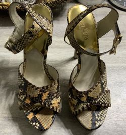 Gently used and very Sexy . The Jet Set 6 by Michael Kors Size 10. $23