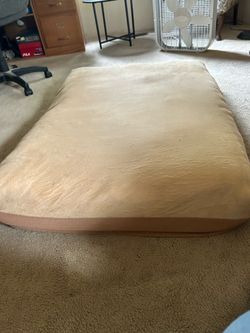 1 large dog bed and 1 small dog bed