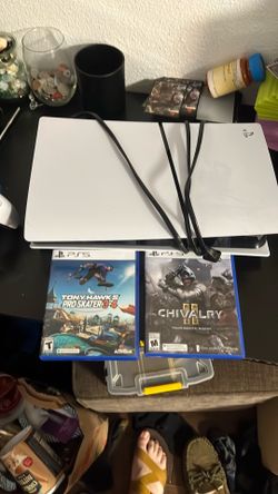 PlayStation 5 with 2 controllers, 2 games and charging dock