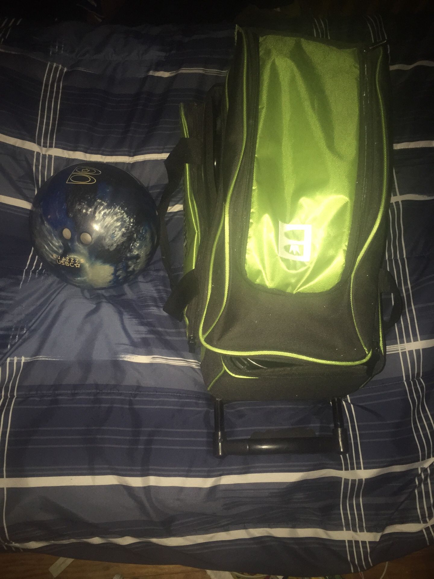 Brunswick 14 lb bowling ball and 2 ball rolling ball bag with shoe storage