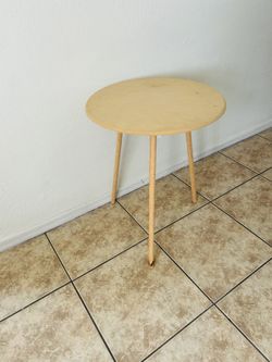 Round  table 24 inches tall  18 inches long