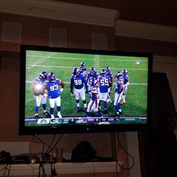 60 inch Sharp TV and remote