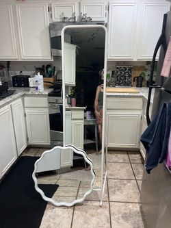 Really cute stand-up mirror with matching wall mirror we can hang hats and clothes or jewelry from stand-up mirror