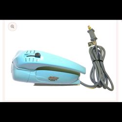 This is a vintage Sunbeam Mixmaster Junior hand mixer, likely produced between 1955 and 1965.  Here's some information about it: Function: It was desi