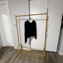 Gold clothing rack with two shoe racks