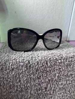 White and black sunglasses with gold bows