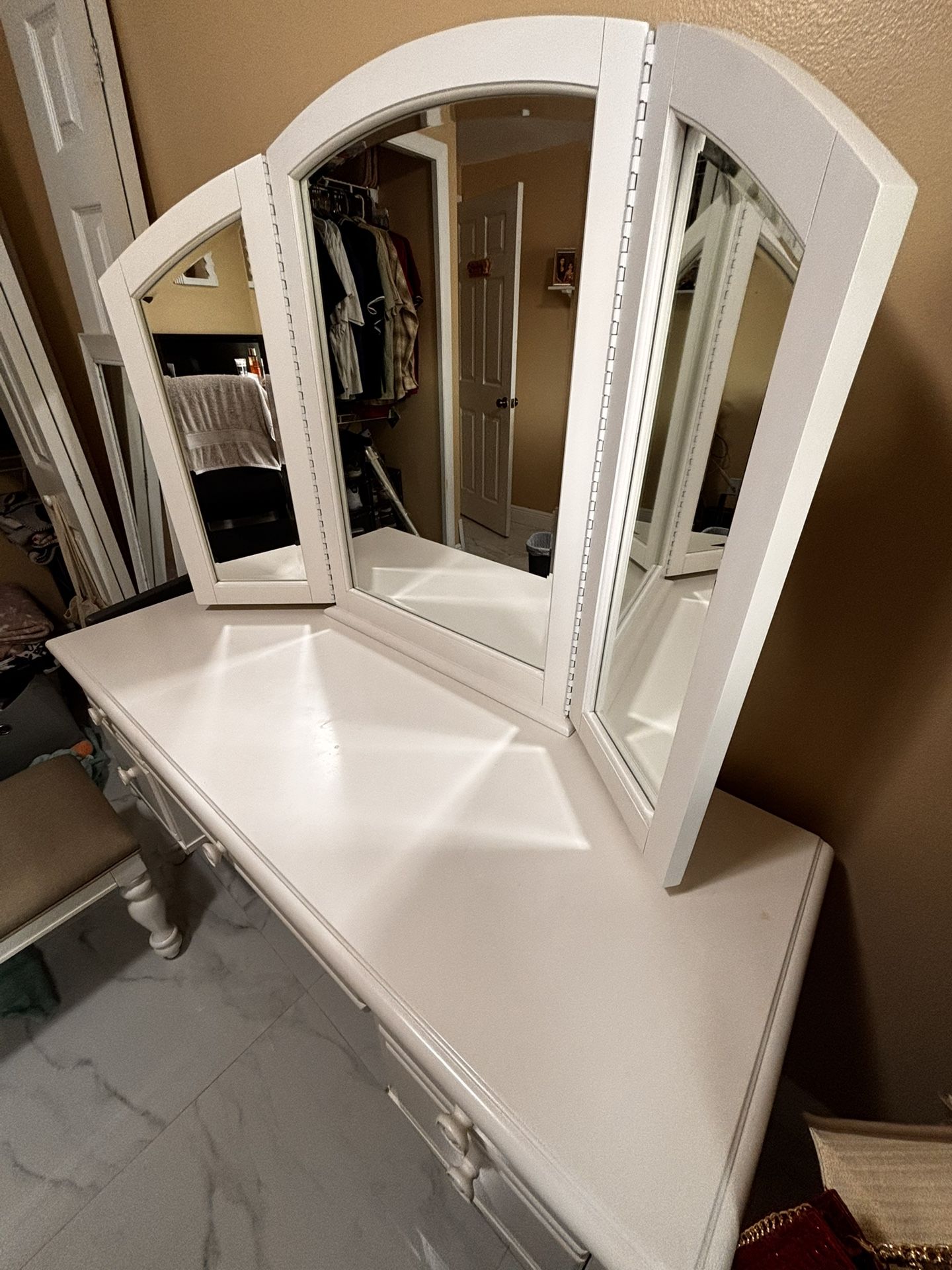 White vanity with mirror and bench