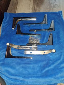 Eight modern couch legs and screws.