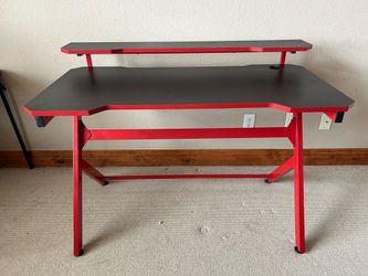 Red and black coloured gaming desk