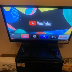 Flat Screen Sanyo TV And Apple TV HD Remote Included & Black mini Fridge 