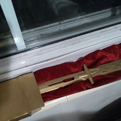 Golden Dagger Wrapped In Red Velvet