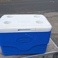 Coleman 48-Quart Cooler with Cup Holders – Blue & White – 23x14x15”
