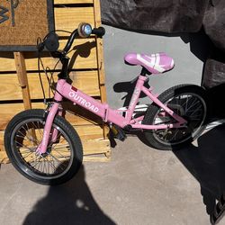 Pink children’s bike