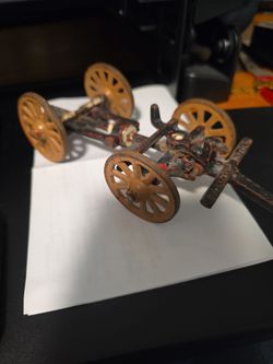 antique die-cast metal or iron miniature model of a field artillery limber wagon