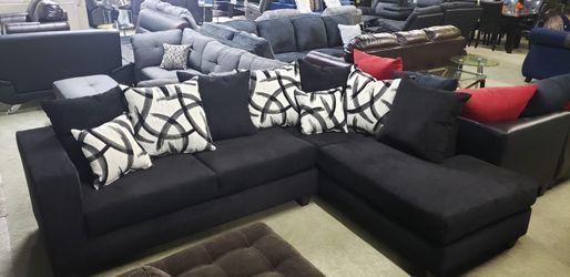 Sectional with pillows black or grey color