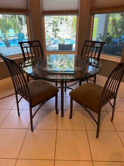 Glass top dining room table and chairs