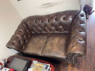 Two Seat 38x66 inch. Brown Leather Sofa