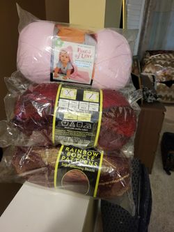 Yarns. 2 Rolls Red Boucle+2 Rolls Burgundy +1 Roll Pinc Regular Yarn.