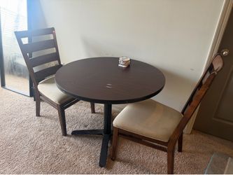 sturdy wooden table and 2 chairs