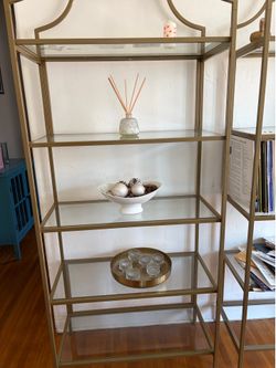 Two identical  gold glass bookshelf