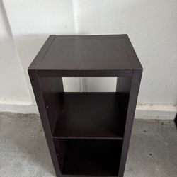 Dark brown wooden shelving unit