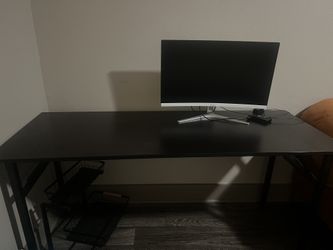 Black desk and Crua Monitor