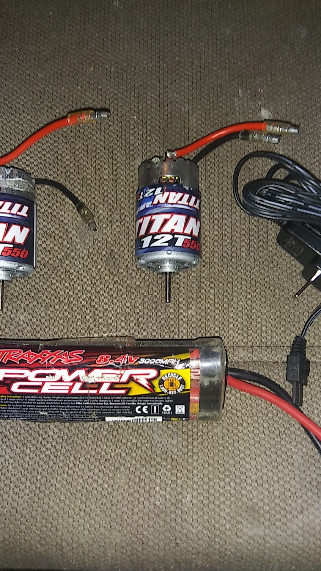 2 Traxxas titan 12t 550 motors, and a Traxxas 8.4v 3000max battery with charger.
