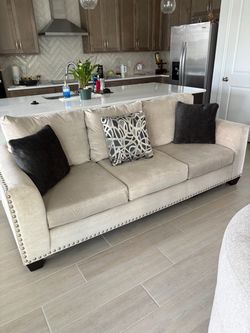 Cream Three-Seat Sofa with Nailhead Trim