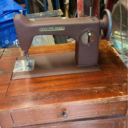 New Home Sewing Machine In Wooden Cabinet