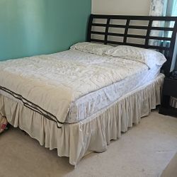 Very Good Condition Queen Bed ( Headboard and Footboard) With Metal Frame. Box Spring And Mattress Included
